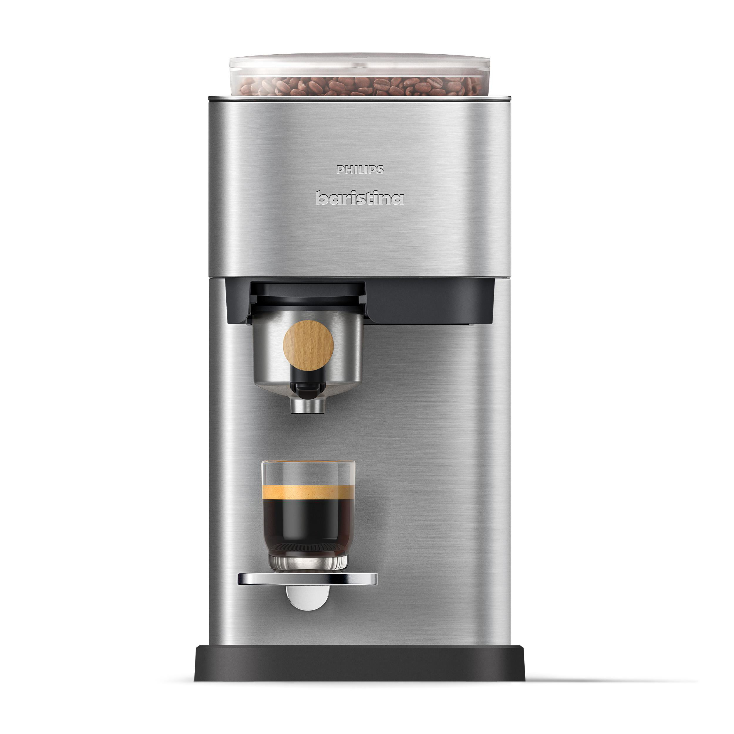 Eine silberne Philips Baristina Kaffeemaschine. Sie hat einen transparenten Bohnenbehälter, einen Siebträger und ein Glas Kaffee. Schwarze Basis.