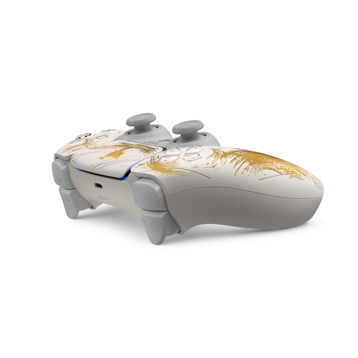 Een witte PlayStation 5-controller met gouden penseelstreken. Hij heeft grijze joysticks en knoppen, tegen een zwarte achtergrond.