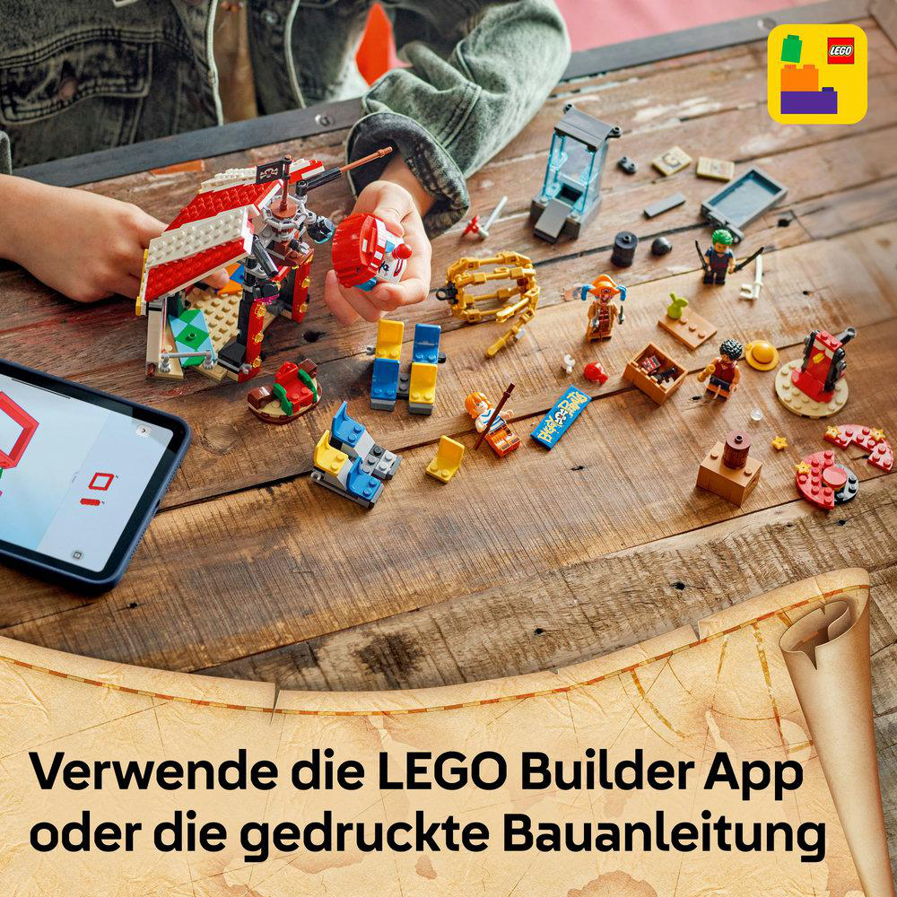 Hände bauen Lego-Sets auf Holz zusammen. Lego-Teile und Tablet liegen auf dem Tisch. Lego-Logo oben rechts.