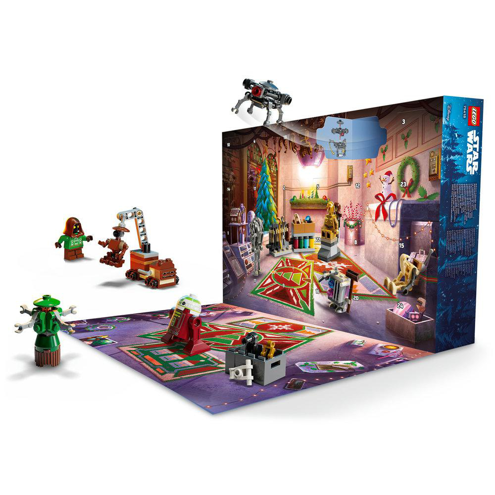 Geöffneter Lego Star Wars Adventskalender, der Szenen und Figuren zeigt. Enthält verschiedene Star Wars Charaktere und eine festliche Innenszene.