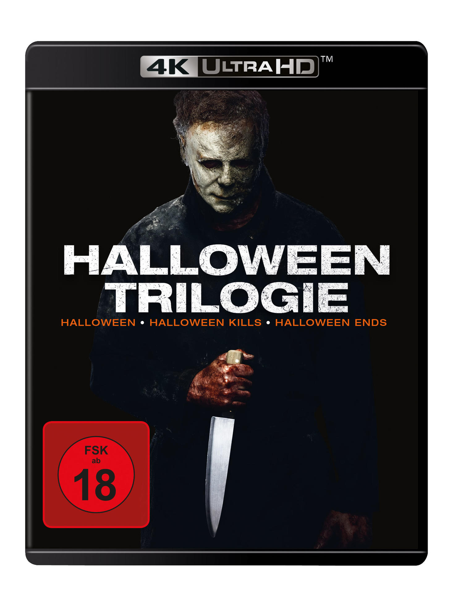 Ein Halloween-Trilogie-Blu-ray-Cover. Michael Myers hält ein Messer. Text: Halloween Trilogie. Bewertung: FSK ab 18. 4K Ultra HD.