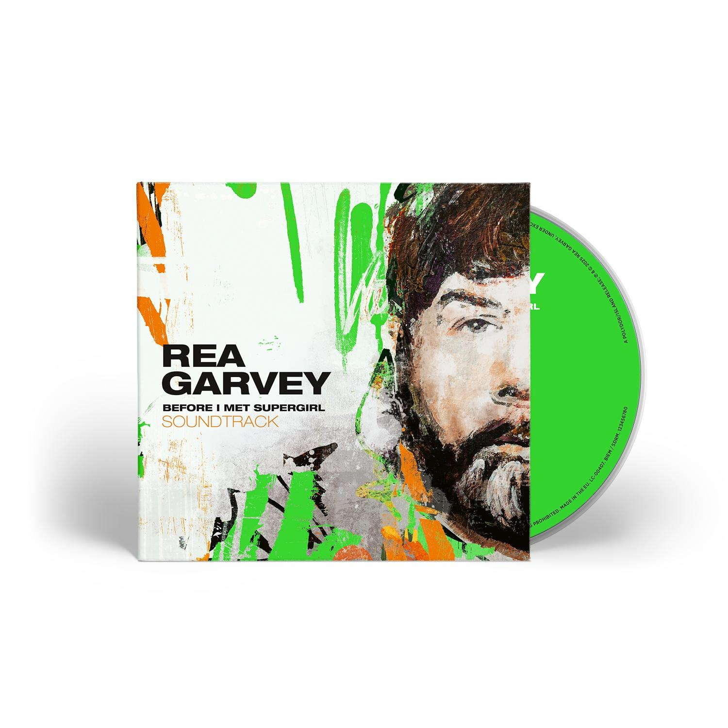CD-Hülle von Rea Garveys 'Before I Met Supergirl Soundtrack'. Mit Porträt, Graffiti-Kunst und grüner Disc.