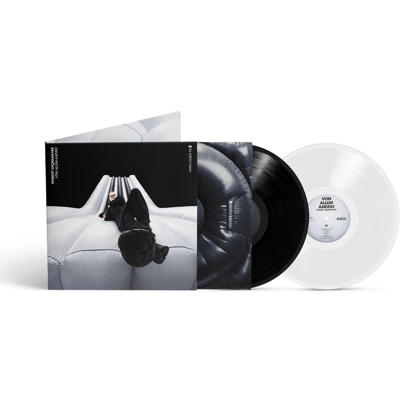 Ein Vinyl-Albumcover mit einer Person, die auf einer weißen aufblasbaren Struktur liegt, zwei Vinylplatten und Text.