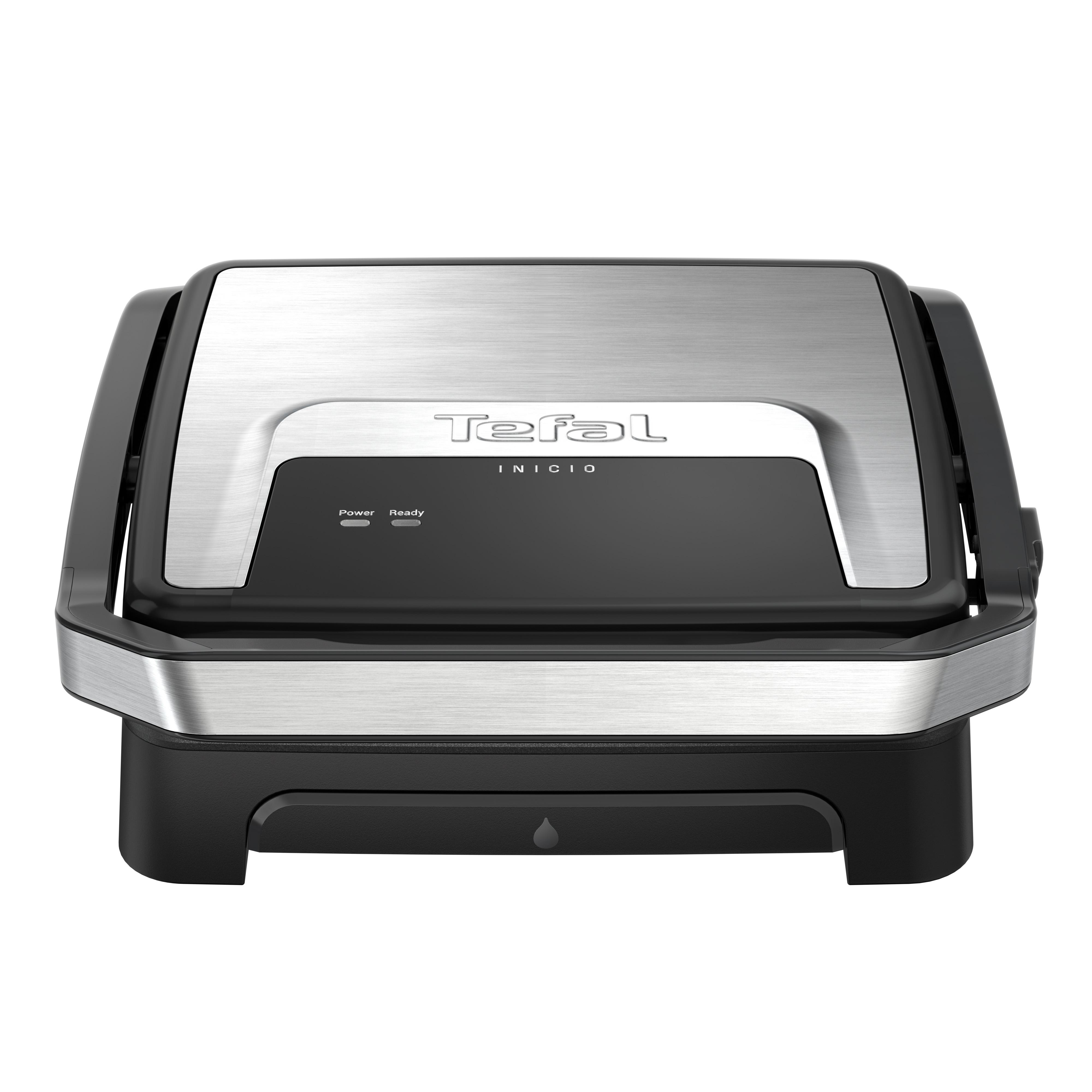 Ein geschlossener Tefal Inicio Grill. Er hat silberne und schwarze Oberflächen mit dem Tefal-Logo. Power- und Ready-Lichter sind sichtbar.