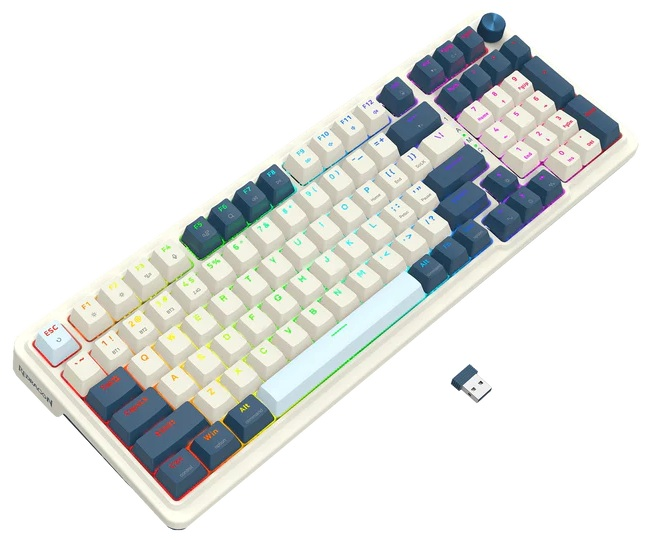 Biała klawiatura mechaniczna z niebieskimi i białymi klawiszami. Odbiornik USB znajduje się po prawej stronie. Klawisze są podświetlane kolorami tęczy.