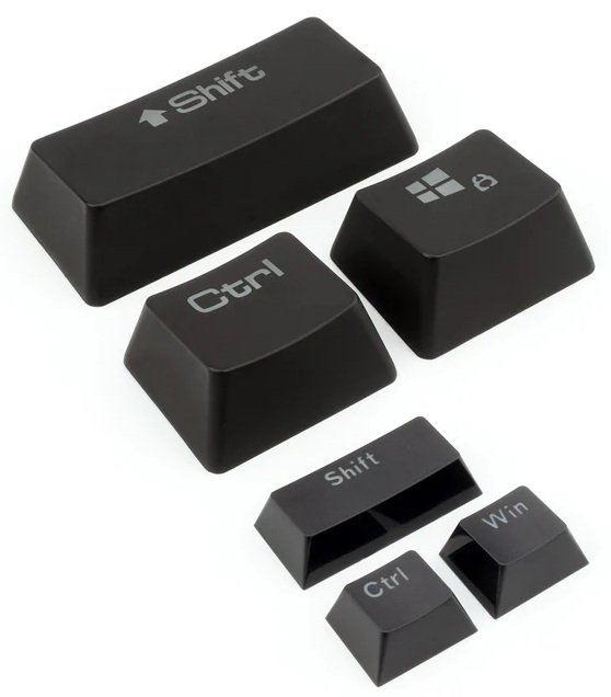 Czarne klawisze klawiatury komputera. Widoczne klawisze Shift, Ctrl i Win. Tło jest białe. Klawisze są ułożone po przekątnej.