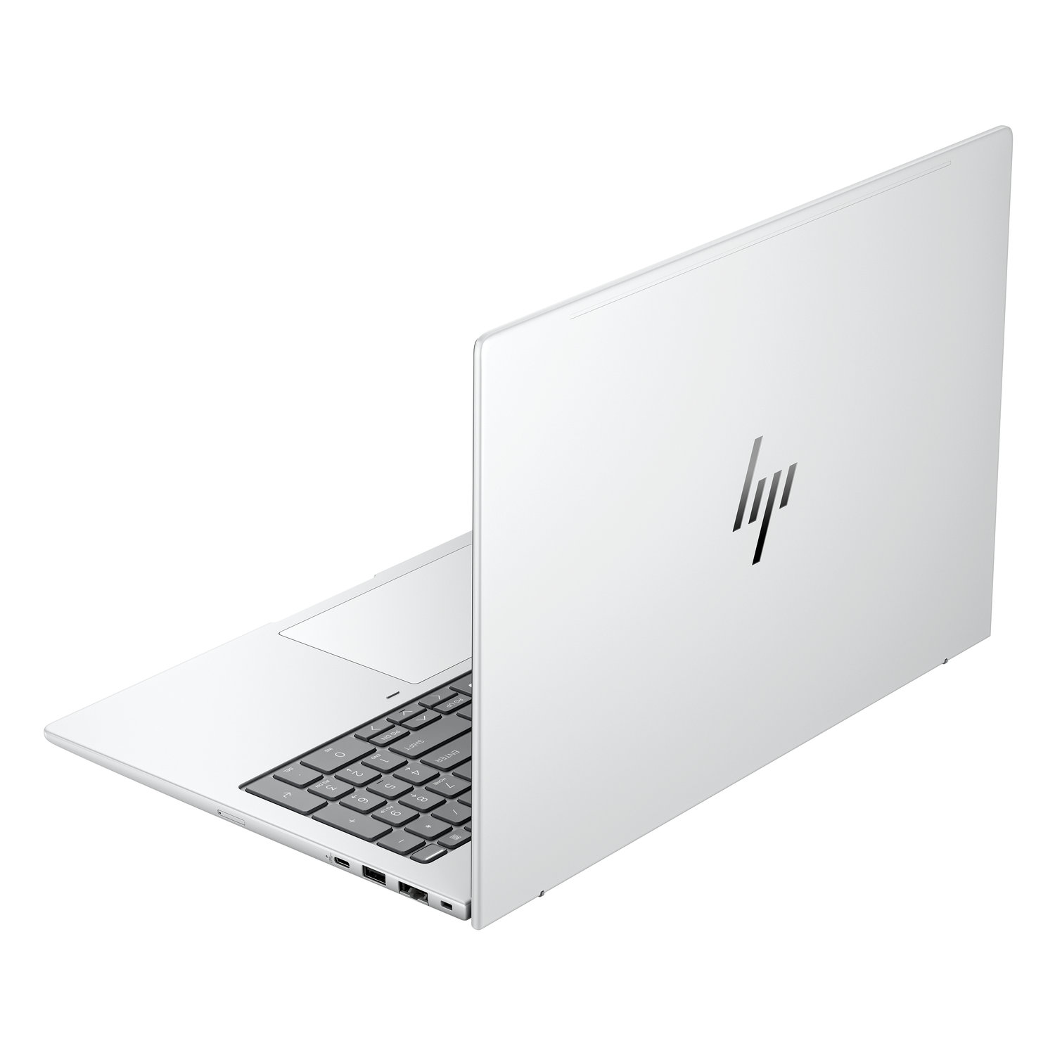 A white HP laptop is open, angled to the right. The keyboard is visible. The HP logo is on the back of the screen.