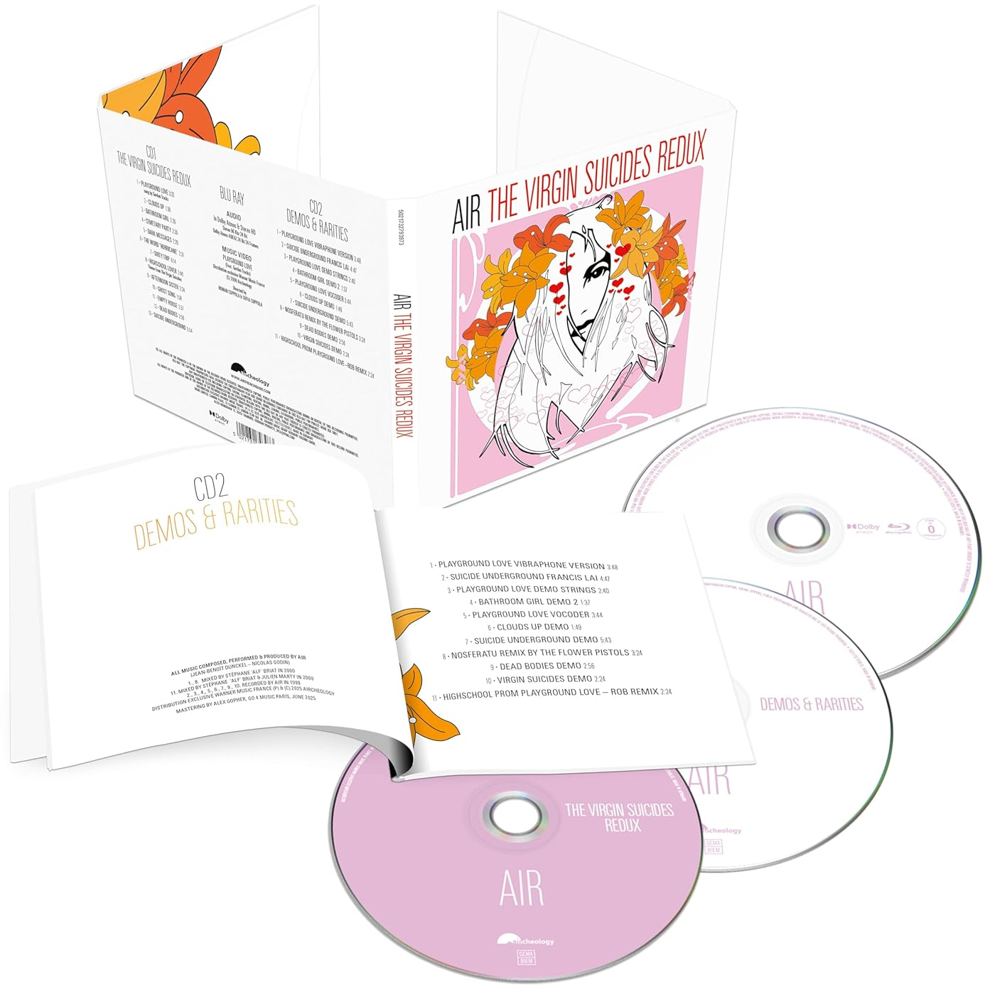 Az Air 'The Virgin Suicides Redux' CD-készlete nyitott tokkal, lemezekkel, rózsaszín borítóval és szöveges részletekkel.