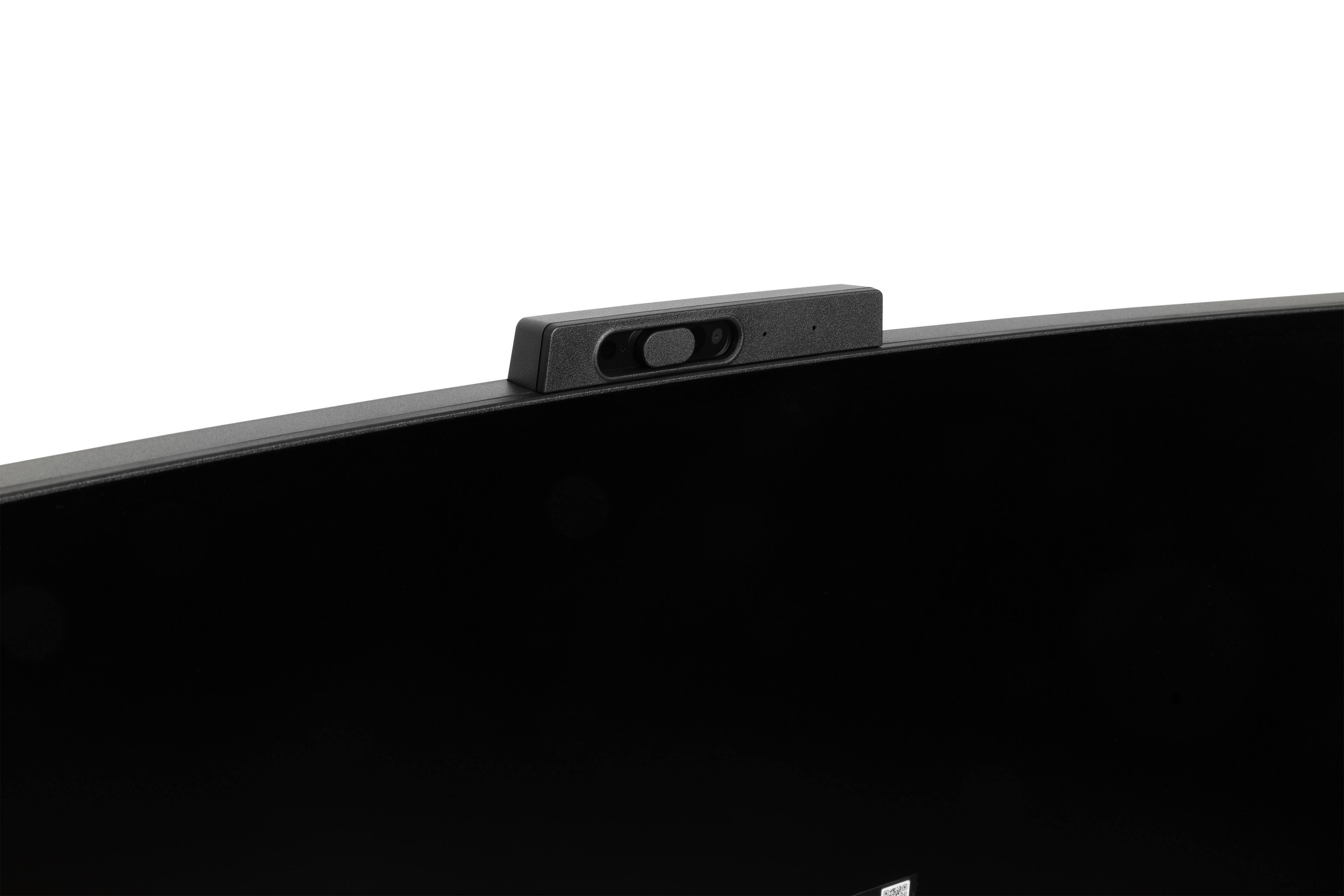 Czarna kamera internetowa na czarnym monitorze z białym tłem. Kamera ma obiektyw i małe światło.