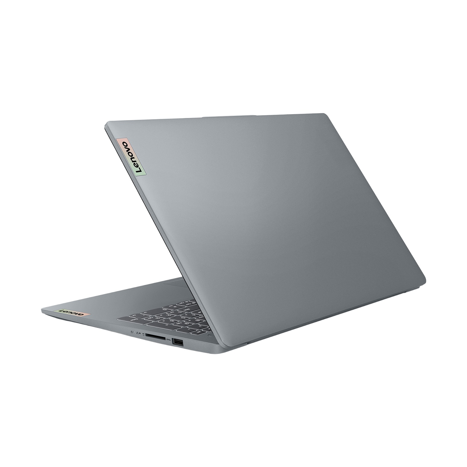Un laptop Lenovo grigio è leggermente aperto, mostrando la tastiera e lo schermo. Il logo Lenovo è visibile in alto e in basso.