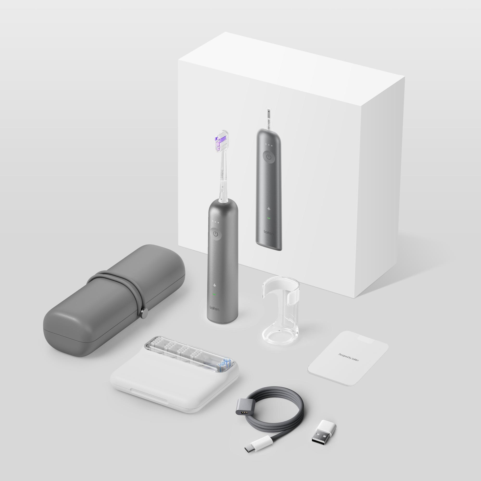 Ein Laifen-Elektrozahnbürsten-Set mit Zahnbürste, Etui, Ladegerät und Zubehör in Grau und Weiß.
