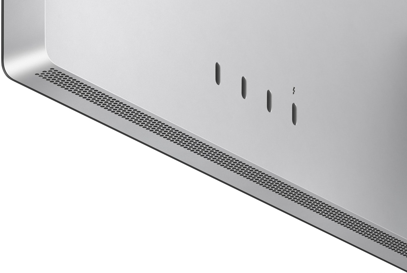 Srebrny narożnik monitora z otworami wentylacyjnymi i symbolem zasilania, na białym tle.