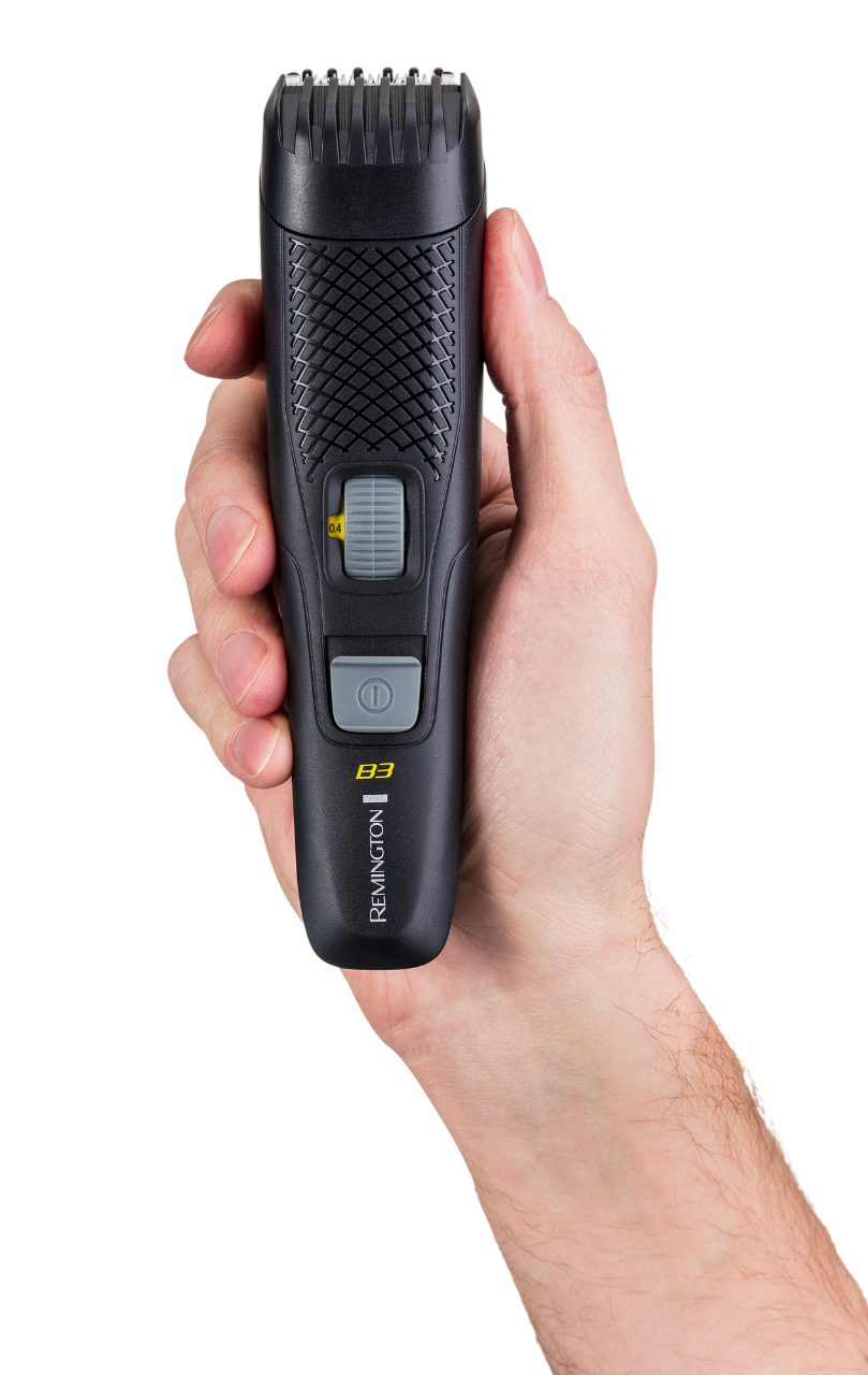 Eine Hand hält einen schwarzen Remington Bartschneider. Der Trimmer hat ein Rad, einen Ein-/Ausschalter und einen Klingenschutz.