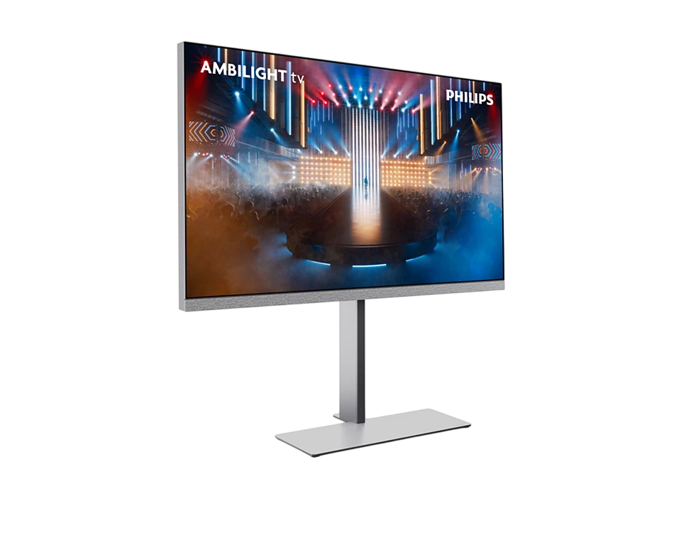 Ein Philips Ambilight-Fernseher zeigt eine Bühnenaufführung. Der Fernseher steht vor schwarzem Hintergrund. Der Bildschirm zeigt die Bühne.