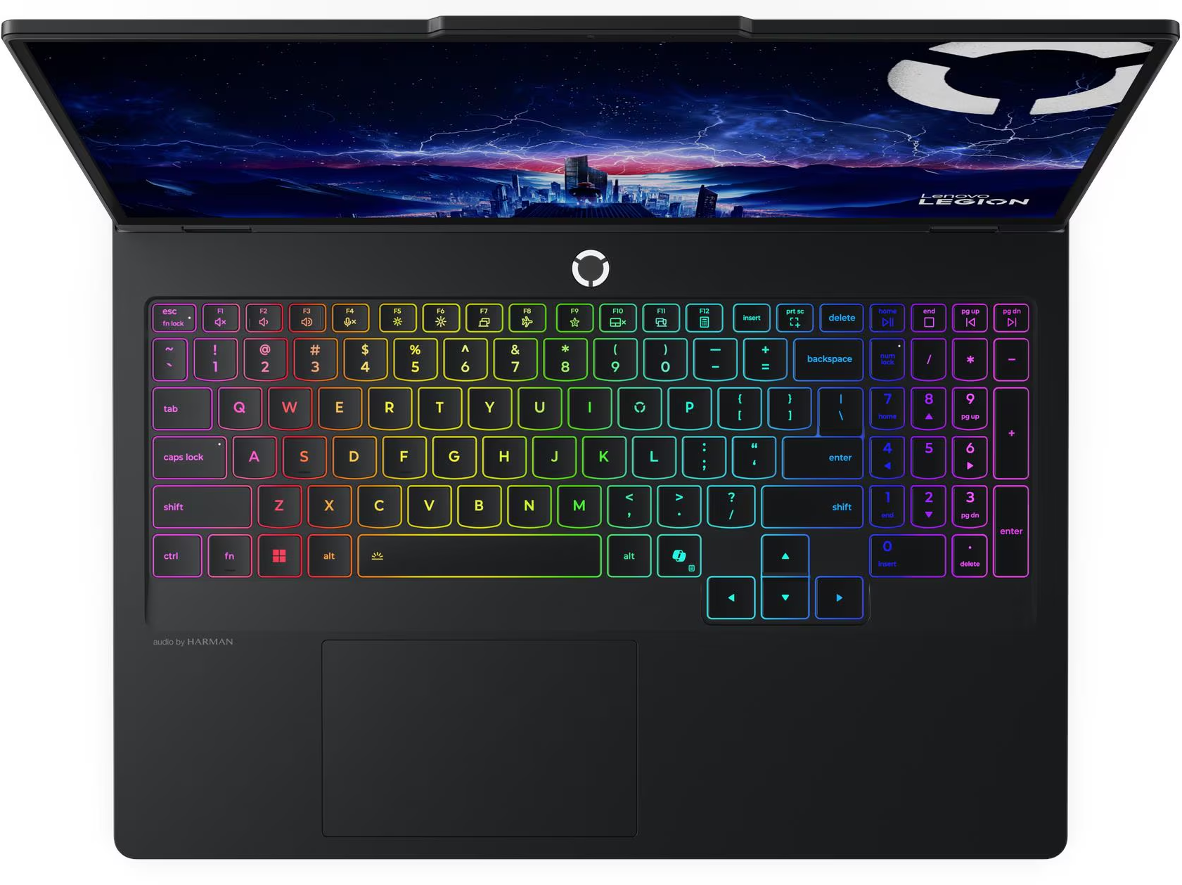Fekete Lenovo Legion laptop. Szivárványszínű megvilágítású billentyűzet. Városkép a képernyőn. Felülnézet.