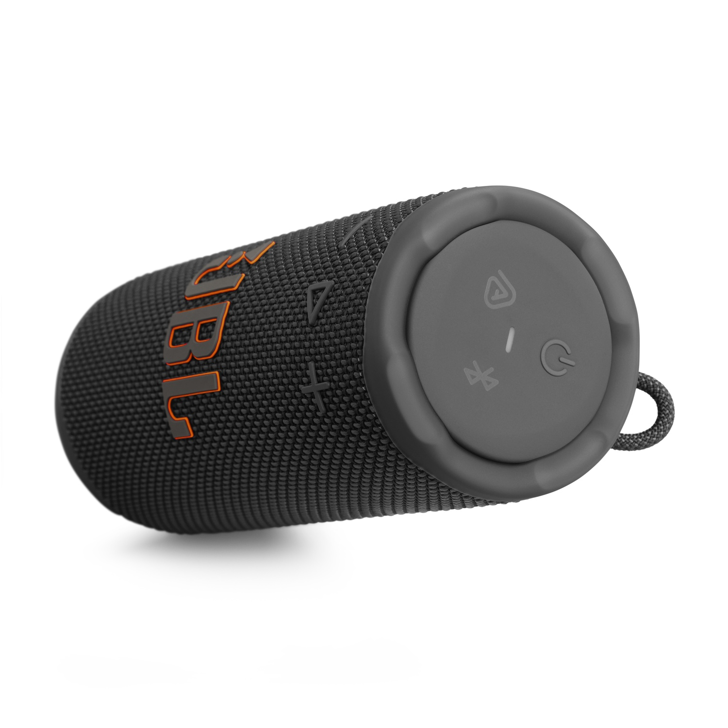 A black JBL speaker with orange accents, lying on a white surface. It has control buttons and a loop. The background is white.