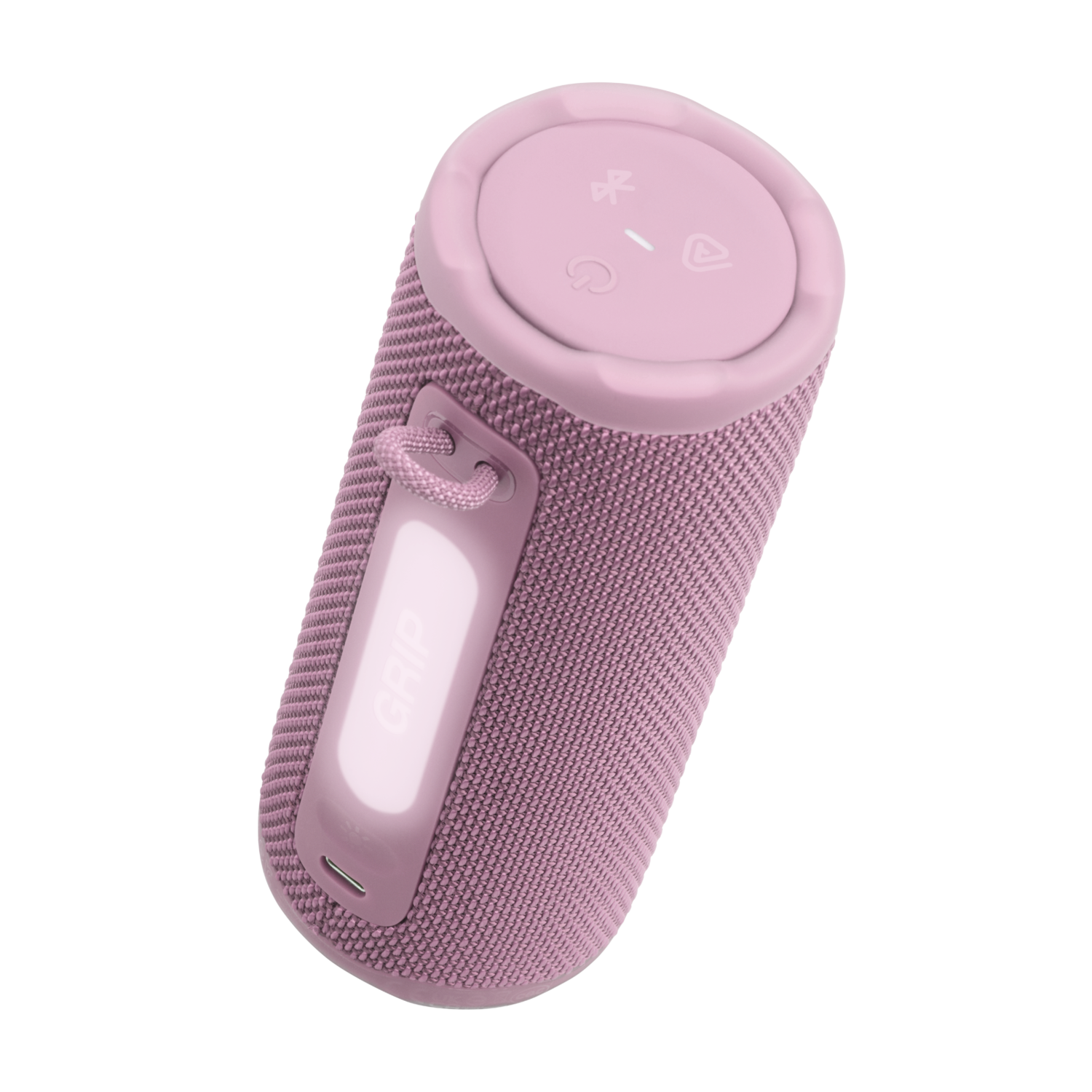 A pink, cylindrical speaker with a fabric texture. It has buttons on top, a handle, and the word "GRIP" is visible on it.