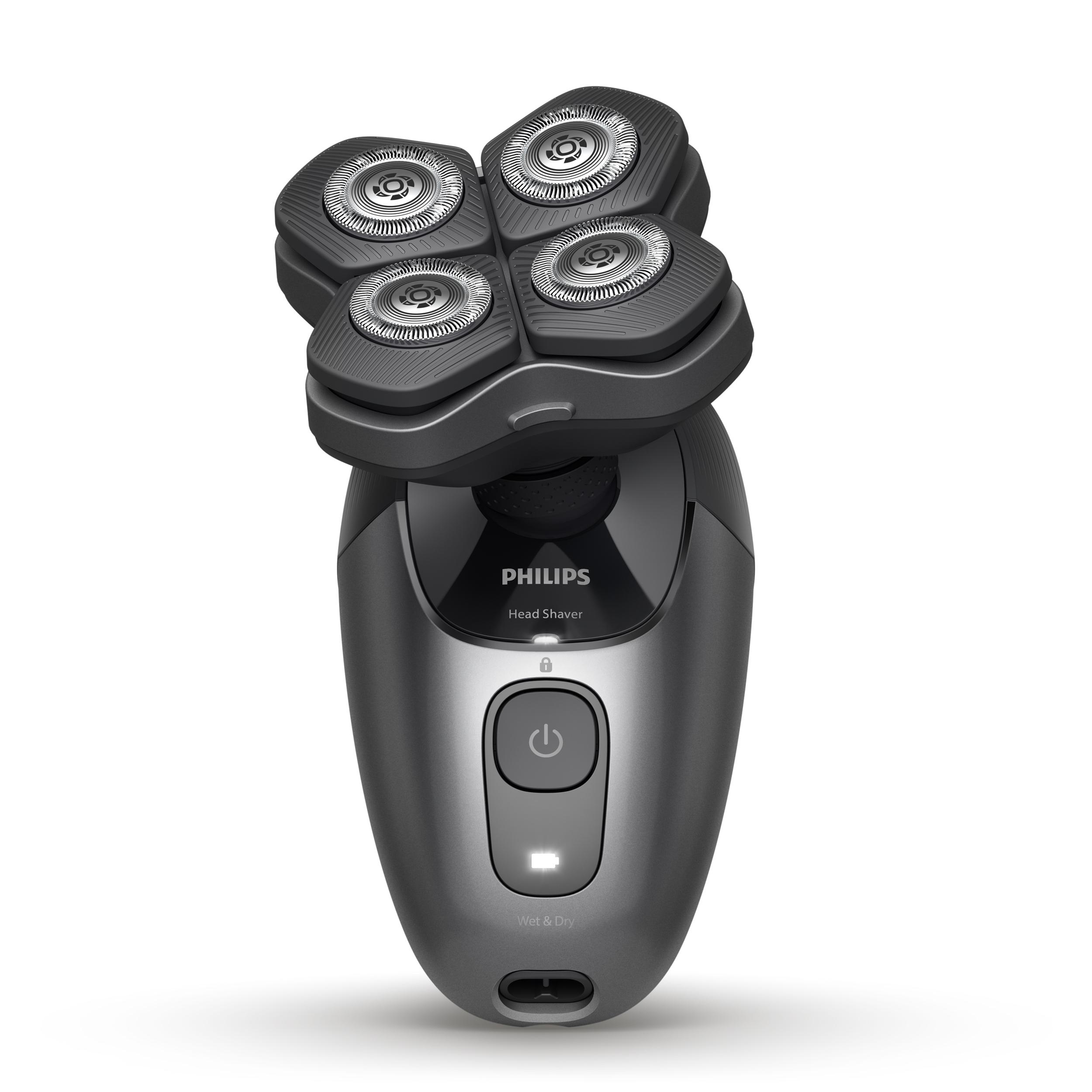 Ein dunkelgrauer Philips-Rasierer mit 4 runden Scherköpfen. Ein Ein-/Ausschalter und eine Batterieanzeige sind sichtbar.