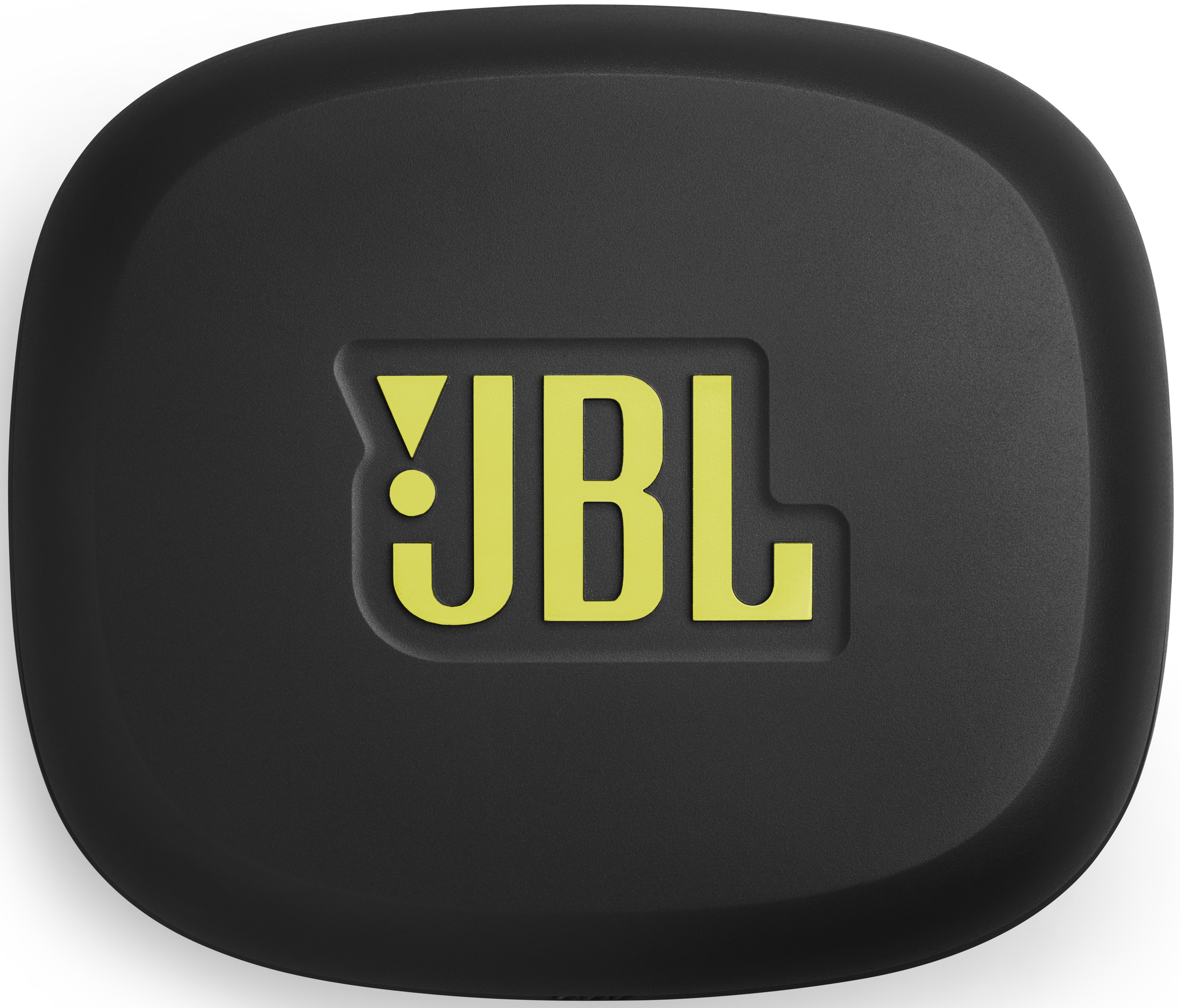 Ein schwarzes, abgerundetes quadratisches Objekt mit dem gelben JBL-Logo in der Mitte. Das Logo ist leicht erhaben und der Hintergrund ist strukturiert.