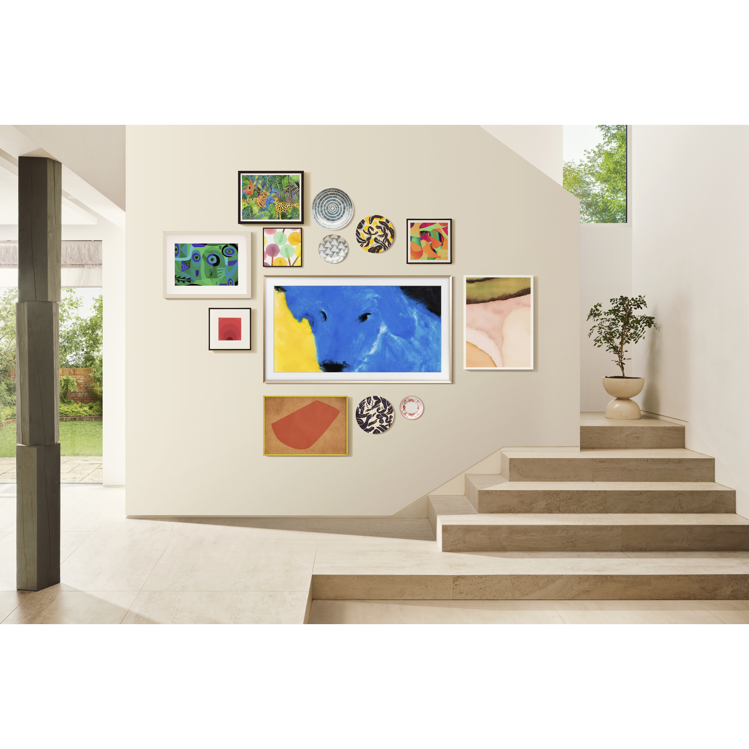 A modern interior with artwork on a wall, including a blue dog painting. A staircase and potted plant are also visible.