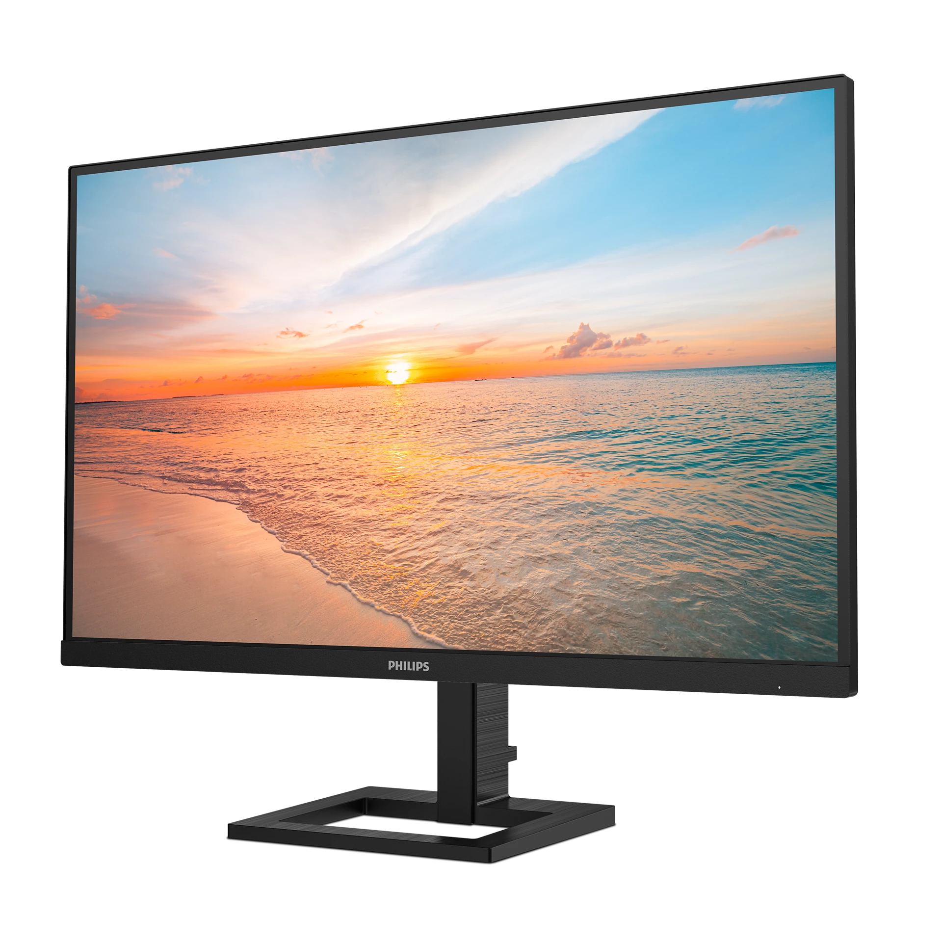 Un monitor Philips muestra una escena de playa al atardecer. La pantalla es negra y el soporte es cuadrado y negro.