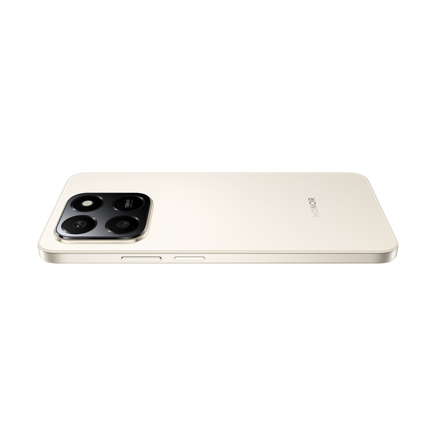 Uno smartphone dorato è sdraiato su un lato, mostrando il gruppo fotocamere e il logo HONOR. Il telefono è su sfondo bianco.