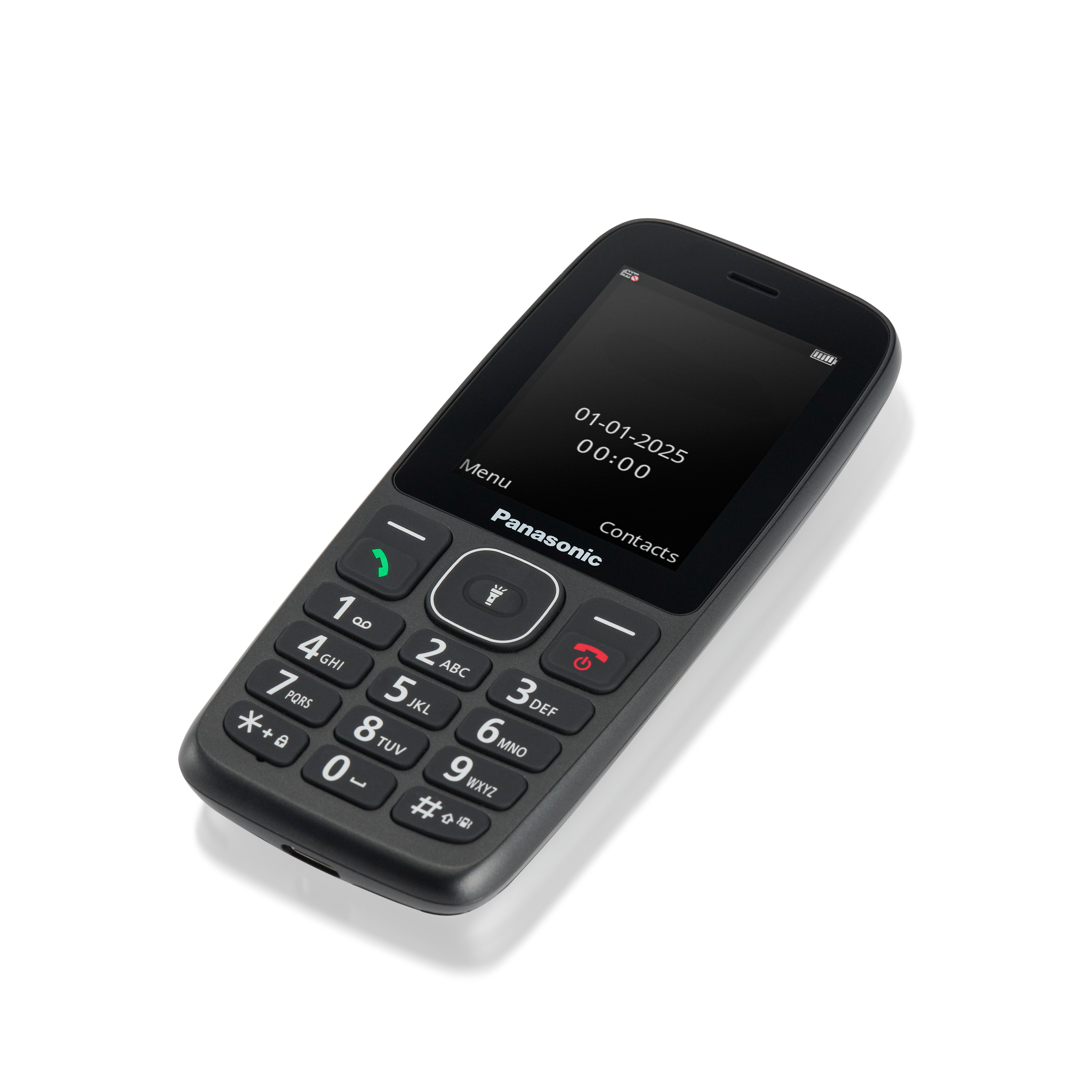 Fekete Panasonic mobiltelefon fehér felületen. A képernyő dátumot és időt mutat. Számbillentyűzete és funkciógombjai vannak.