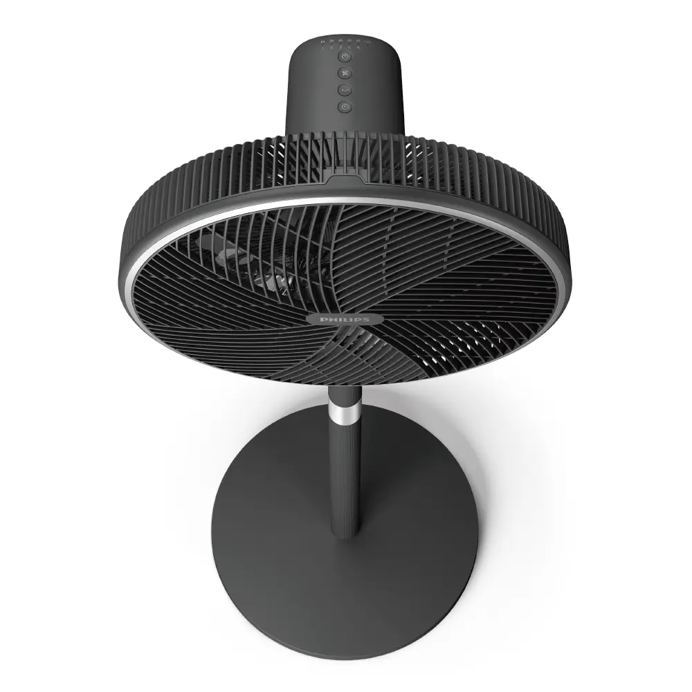 Un ventilador de pie Philips negro. Tiene una base redonda, un soporte vertical y un cabezal de ventilador circular.