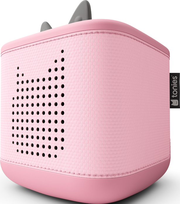 Eine rosa Toniebox, ein Kinderaudioplayer, mit einem katzenförmigen Lautsprecherdesign. Sie hat graue Ohren oben und den Markennamen an der Seite.