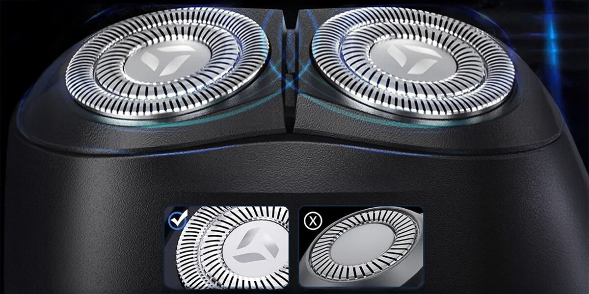 Zbliżenie głowicy golarki elektrycznej z dwoma srebrnymi, okrągłymi ostrzami. Czarny korpus z dwoma wstawionymi diagramami.