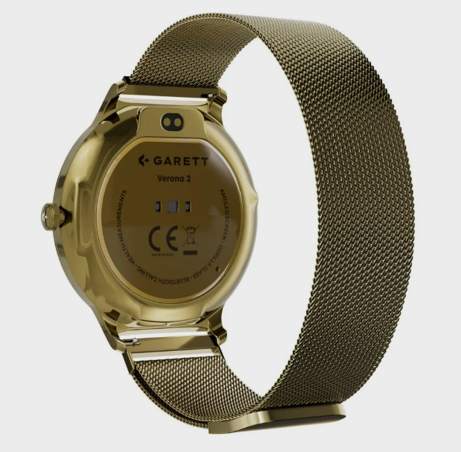 Złoty smartwatch z siatkowym paskiem, tył z nazwą marki 'Garett Verona 2' i funkcjami. Pasek jest pętlą.