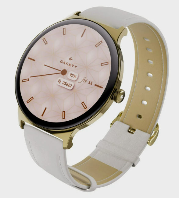 Złoty smartwatch z białym paskiem. Tarcza jest jasnoróżowa ze złotymi detalami. Wyświetla czas, datę i wskaźniki zdrowia.