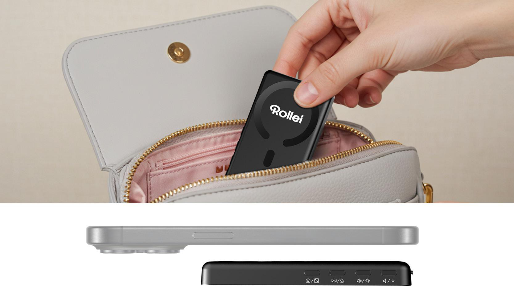 Eine Hand legt ein schwarzes Rollei-Gerät in eine graue Handtasche. Darunter sind ein silbernes Telefon und die Unterseite des schwarzen Geräts zu sehen.