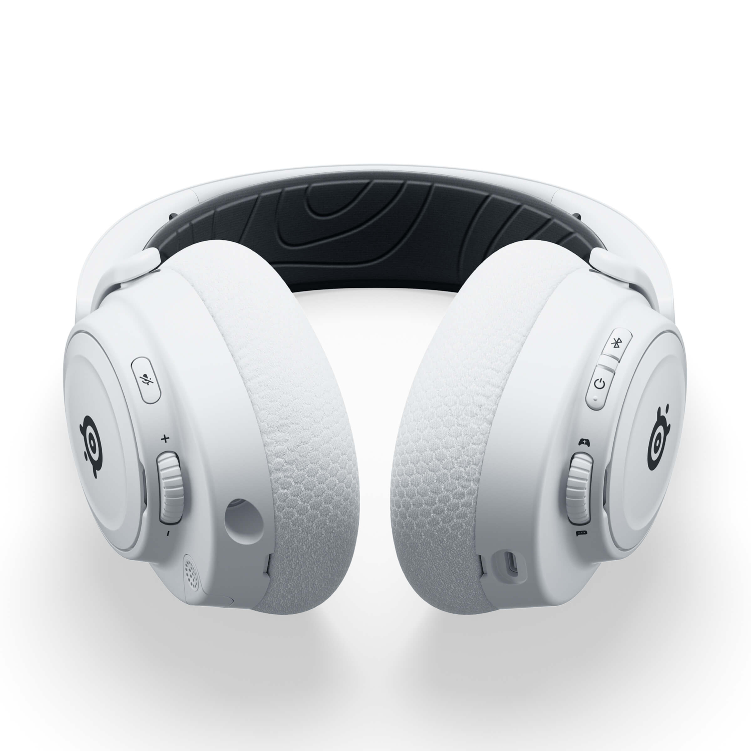 White headphones, SteelSeries brand, on white background. Black interior on the top of the headphones. Volume control and power buttons.