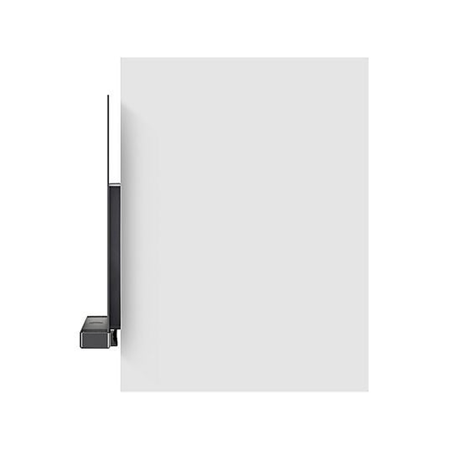 A dark, rectangular object, possibly a TV, mounted on a white wall. A dark shelf is below it. The background is mostly white.
