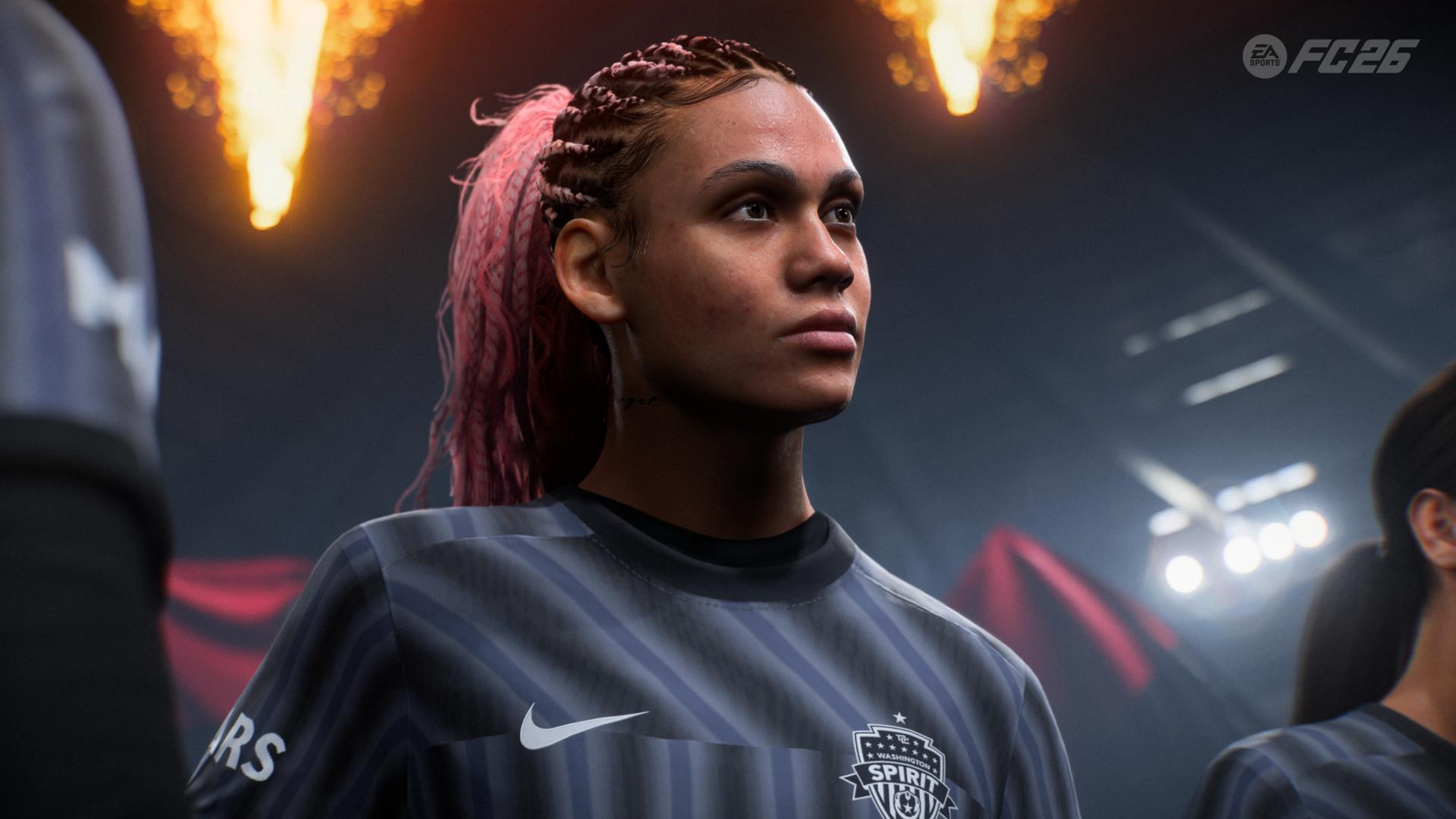 Eine Fußballspielerin mit rosa Haaren blickt nach oben und trägt ein dunkles Trikot. Der Hintergrund zeigt Lichter und ein Stadion.