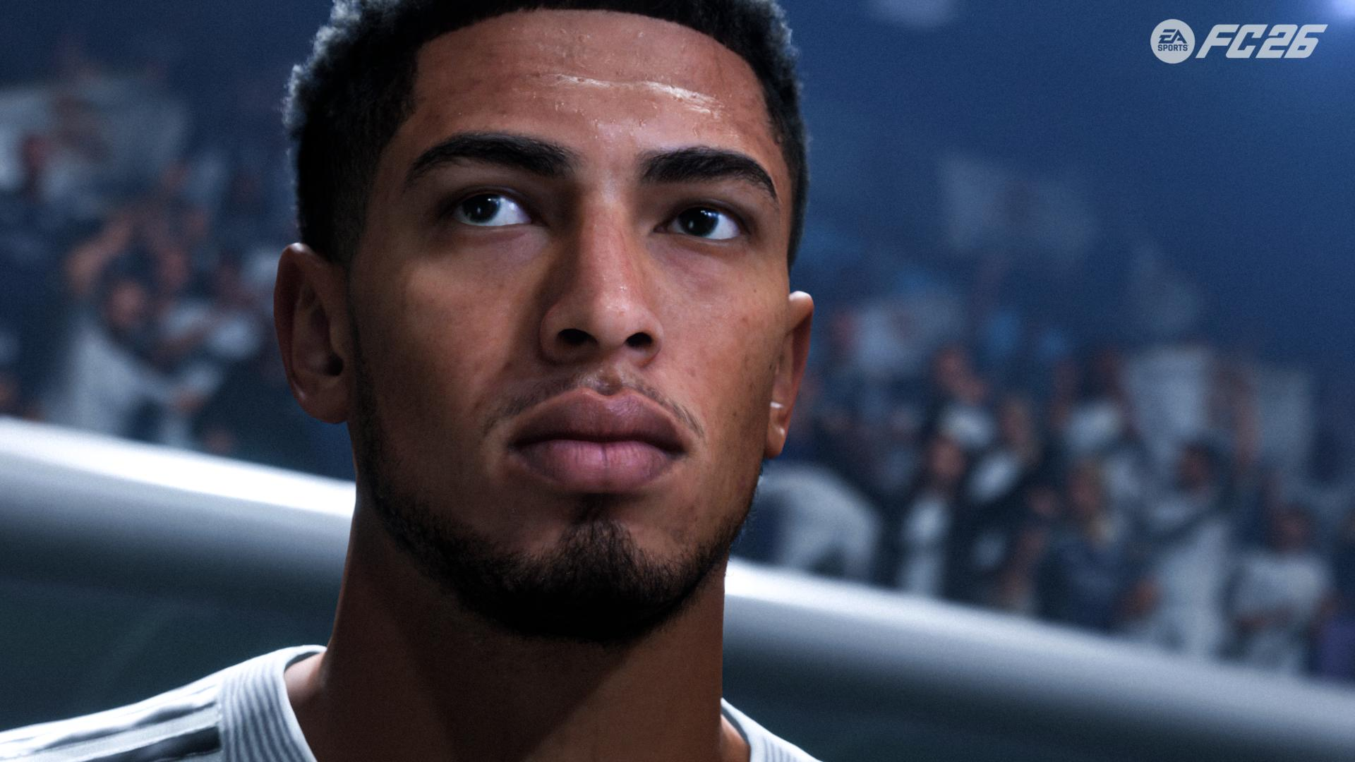 Nahaufnahme eines Fußballspielers, der nach oben blickt. Er hat dunkles Haar und einen Bart. Im Hintergrund sind eine Menge und das EA FC26-Logo zu sehen.