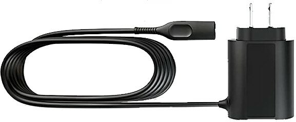 Czarna ładowarka z czarnym kablem. Kabel jest zapętlony. Ładowarka ma dwa bolce i prostokątny korpus.