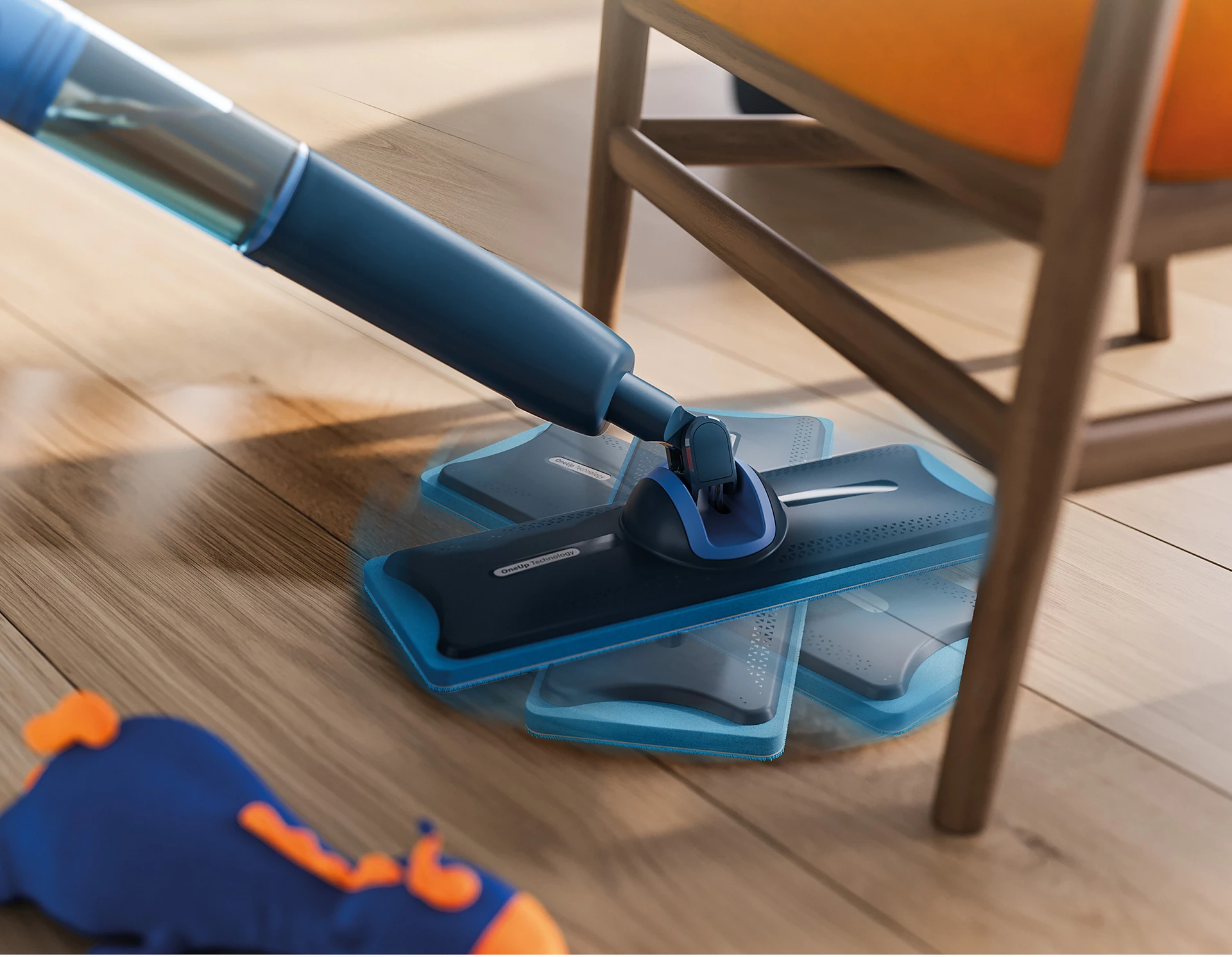 Une serpillère bleue et noire est sur un plancher en bois. Une chaise est en arrière-plan.