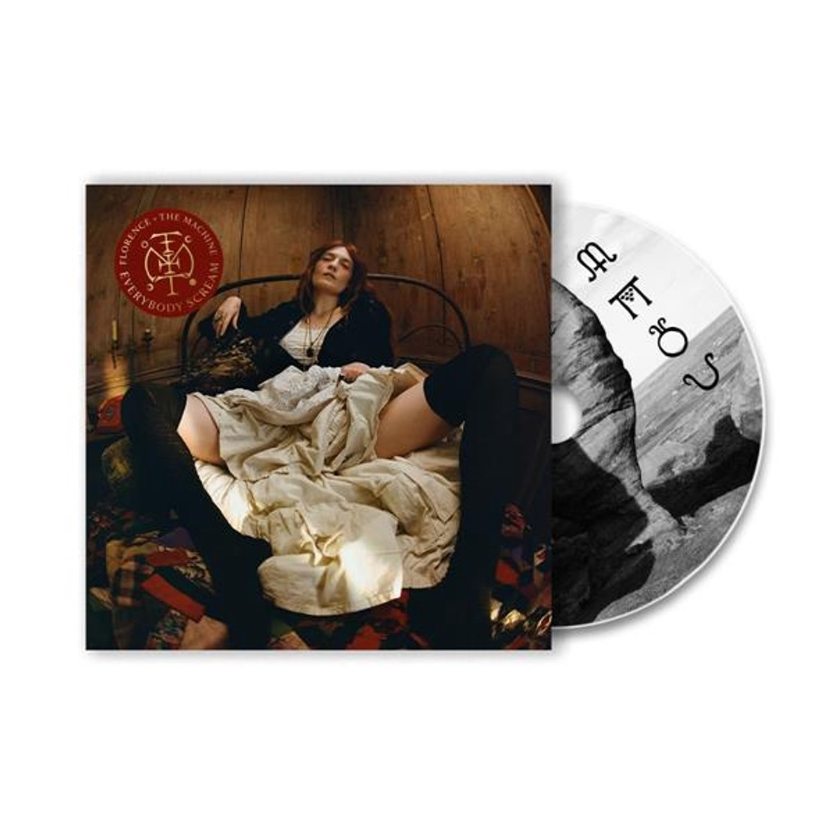 Pochette d'album : Florence + The Machine, assise sur un lit. CD à côté. Le CD a une image de montagne en noir et blanc.