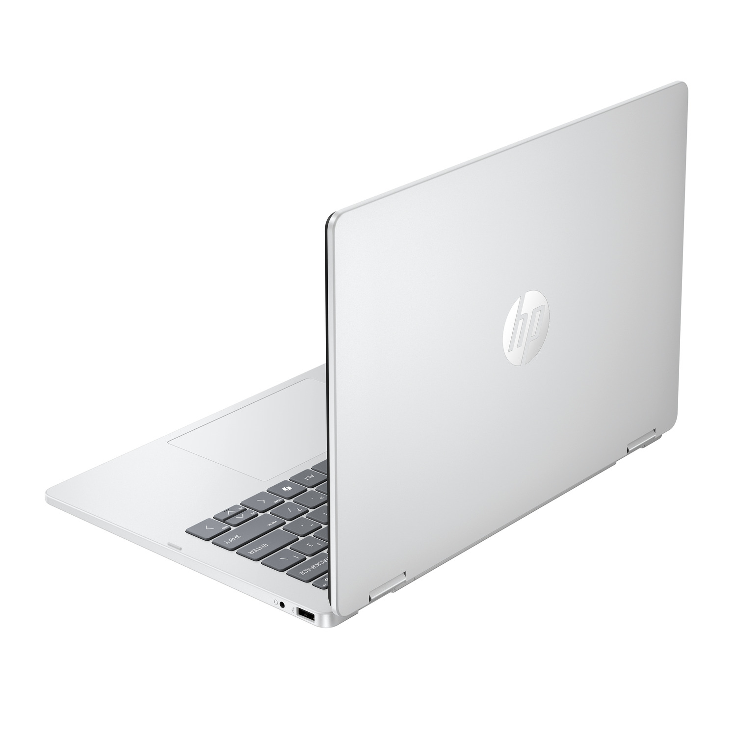 A silver HP laptop is partially open. The screen has the HP logo. The keyboard is visible. White background.