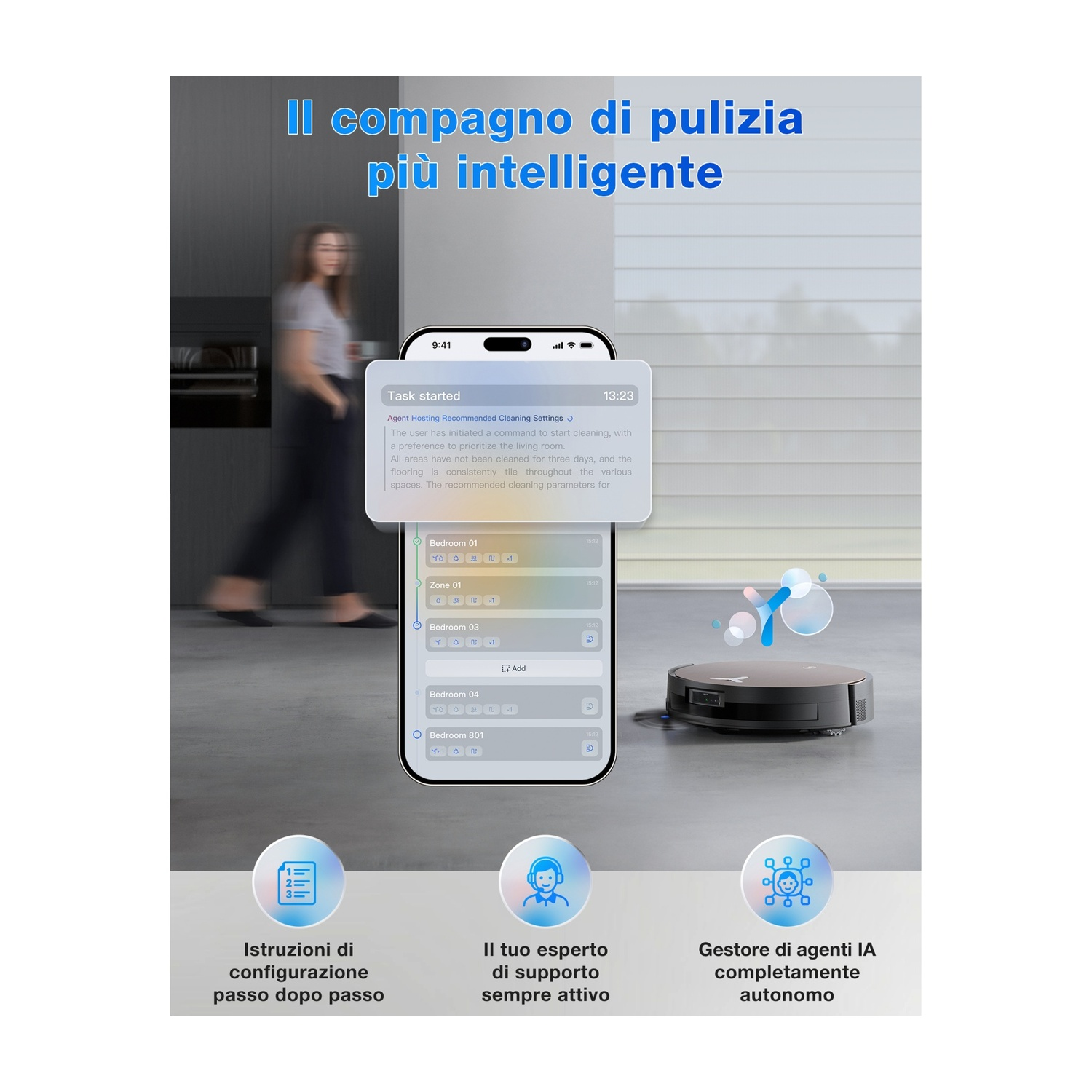 Un robot aspirapolvere è sul pavimento. Lo schermo del telefono mostra le impostazioni di pulizia. Una donna cammina sullo sfondo.