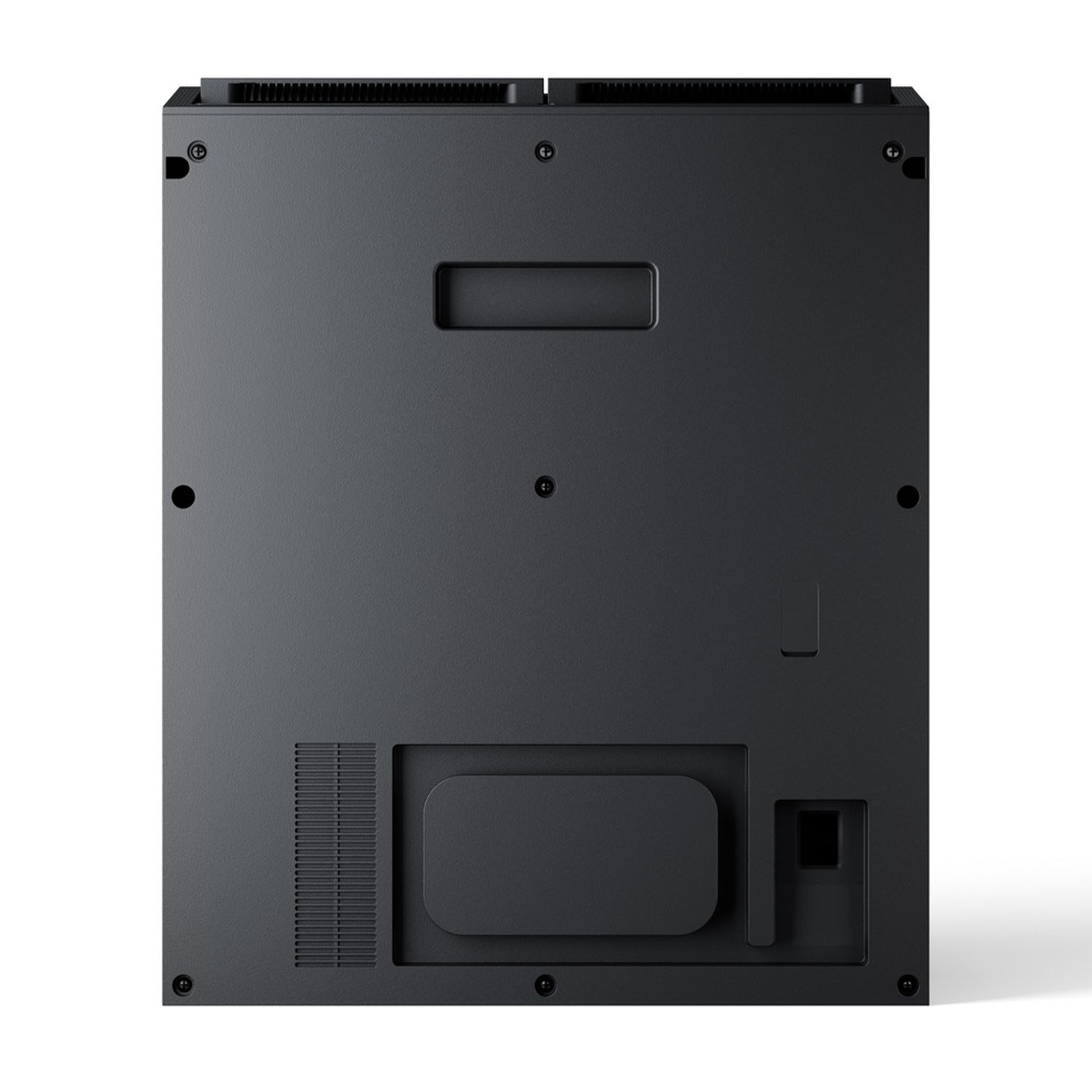 Un dispositivo elettronico nero, forse una console, visto da dietro. Ha varie porte, viti e una griglia rettangolare.