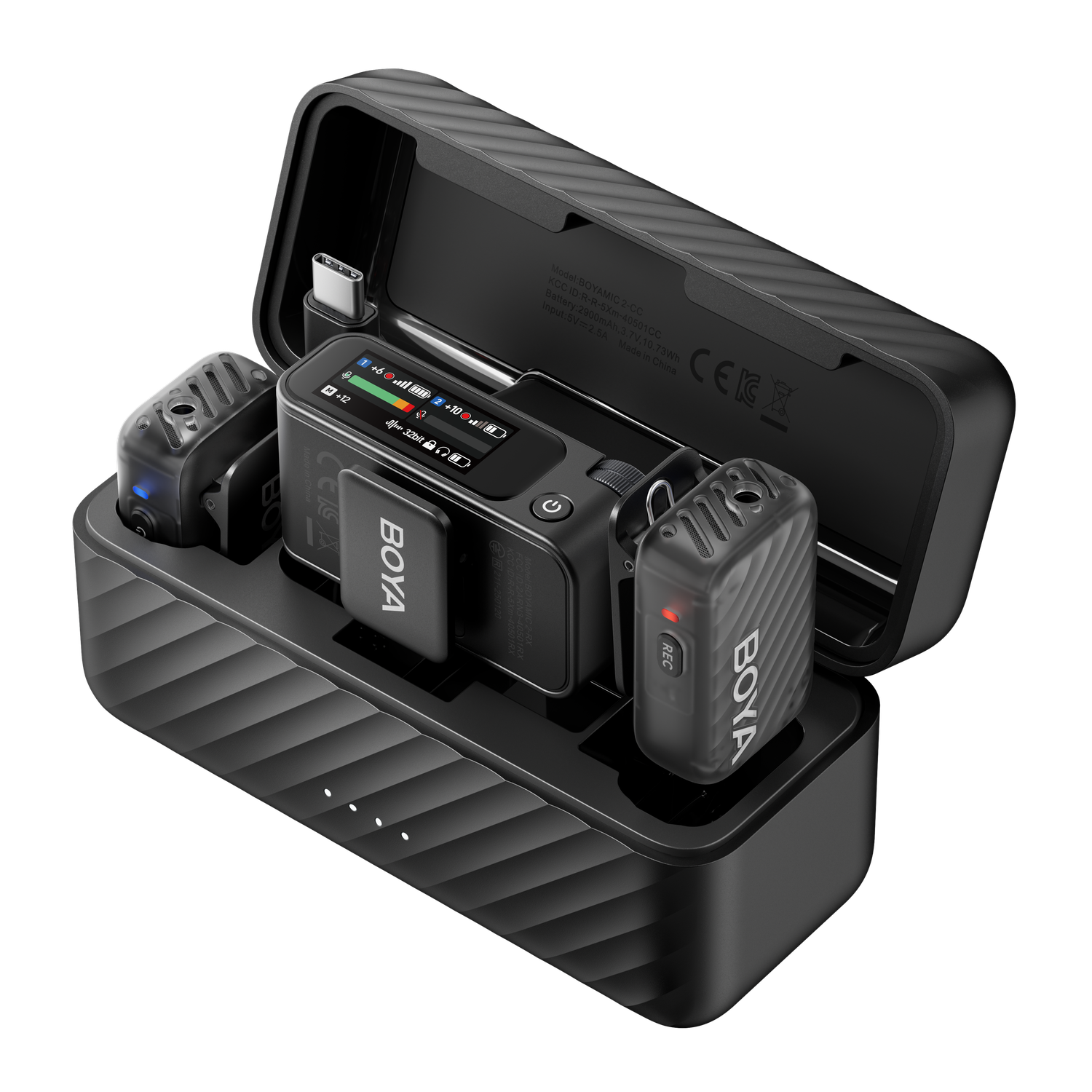 Black wireless microphone kit with charging case. Components include a receiver, two transmitters, and a charging base. Displays and buttons are visible.