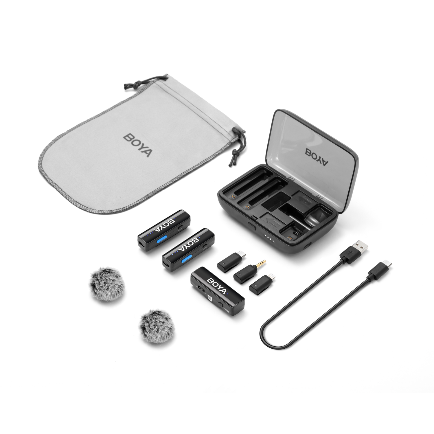 BOYA wireless microphone kit on white. Includes case, pouch, mics, adapters, and charging cable. Components are black and gray.