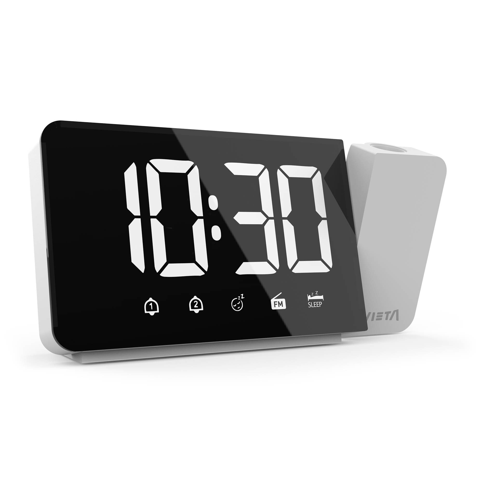 Reloj digital que muestra 10:30. Tiene una pantalla negra con números blancos y un cuerpo blanco. Incluye iconos de alarma y reposo.