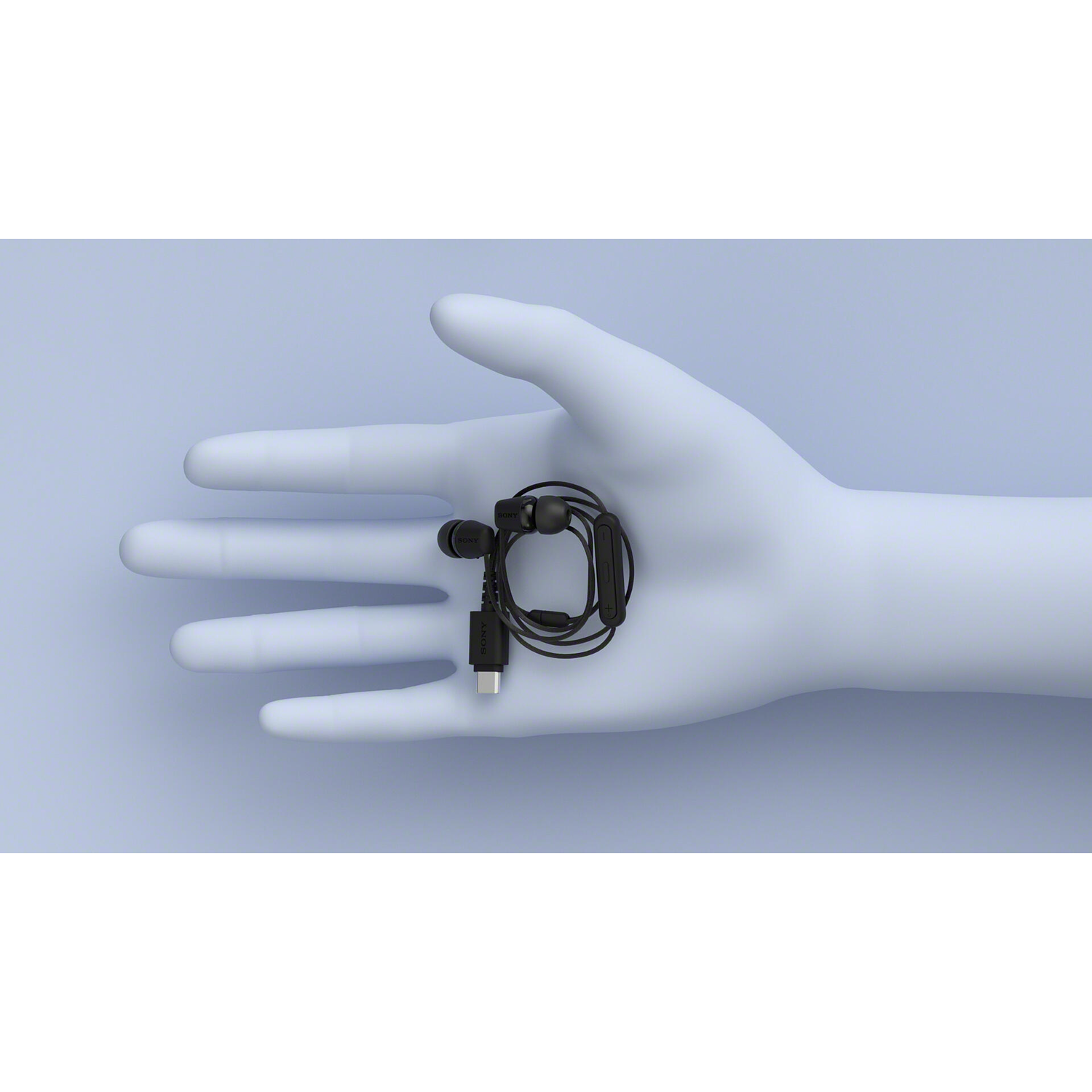 A hand holds black earphones with a USB-C connector. The hand is light blue, and the background is also light blue.
