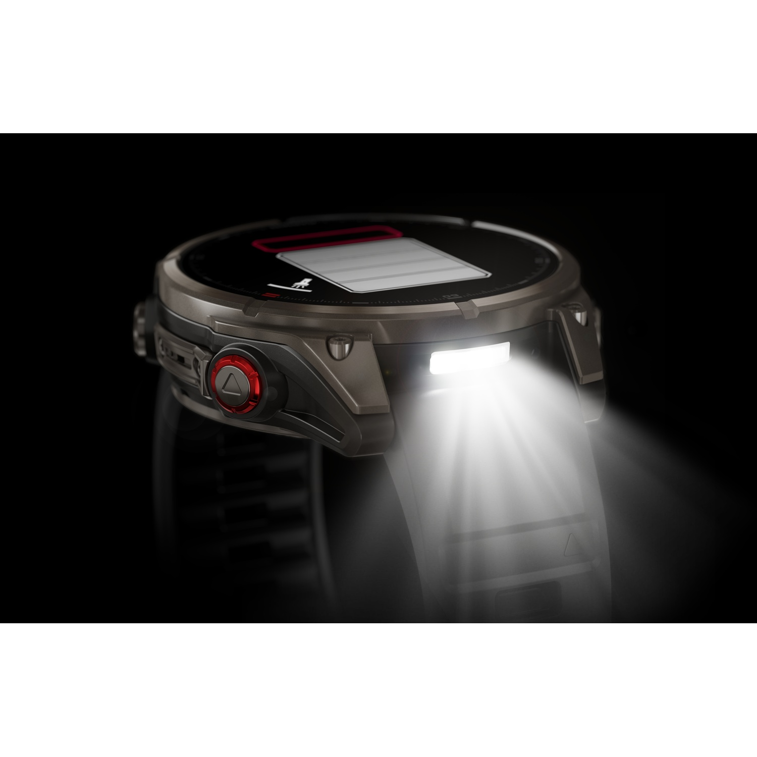 Close-up van een smartwatch met helder licht. Het horloge is donkergrijs met een rode knop. Het scherm toont een batterij-icoon.