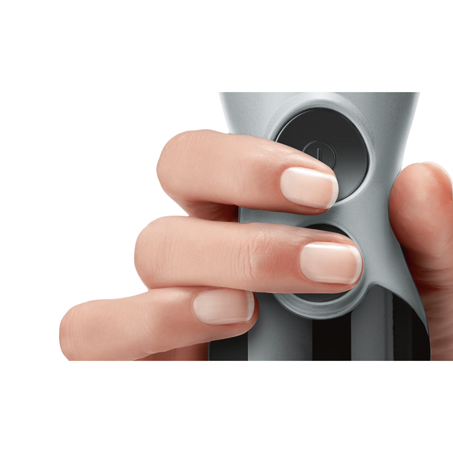 A hand holds a gray blender. Fingers press buttons. The background is white.