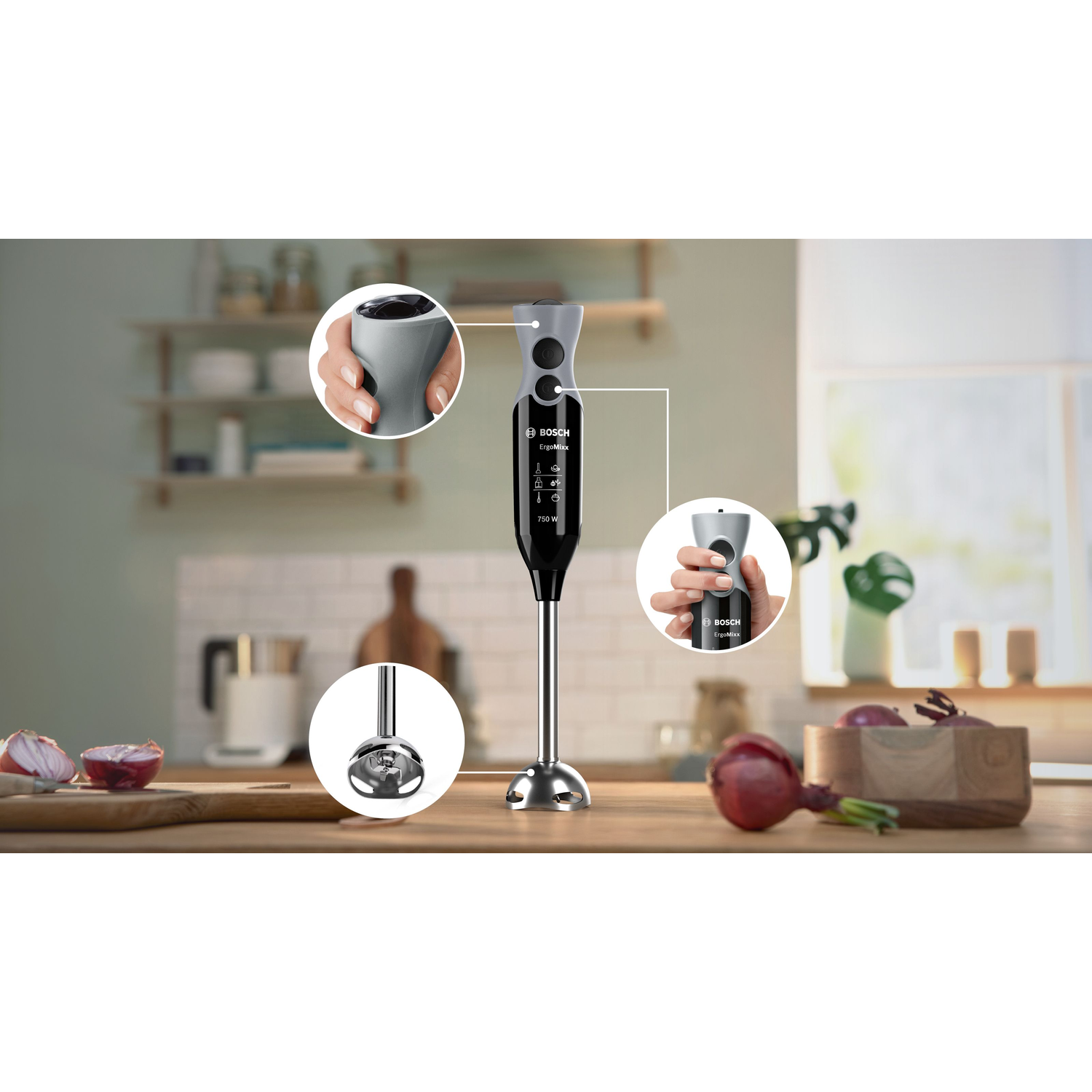 A Bosch ErgoMixx hand blender is displayed. Red onions and a wooden bowl are on a wooden surface. The blender has gray and black parts.